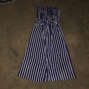 A blue and white romper with a matching belt